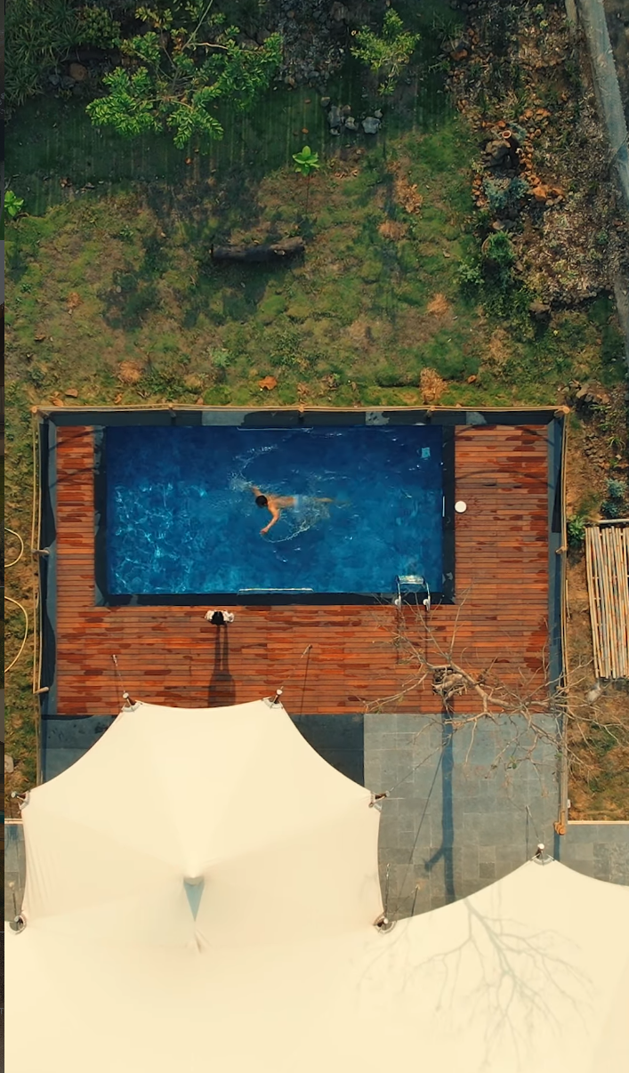 Overhead view of The Opal+ canvas roof, outdoor deck and swimming pool at Untamed Paws